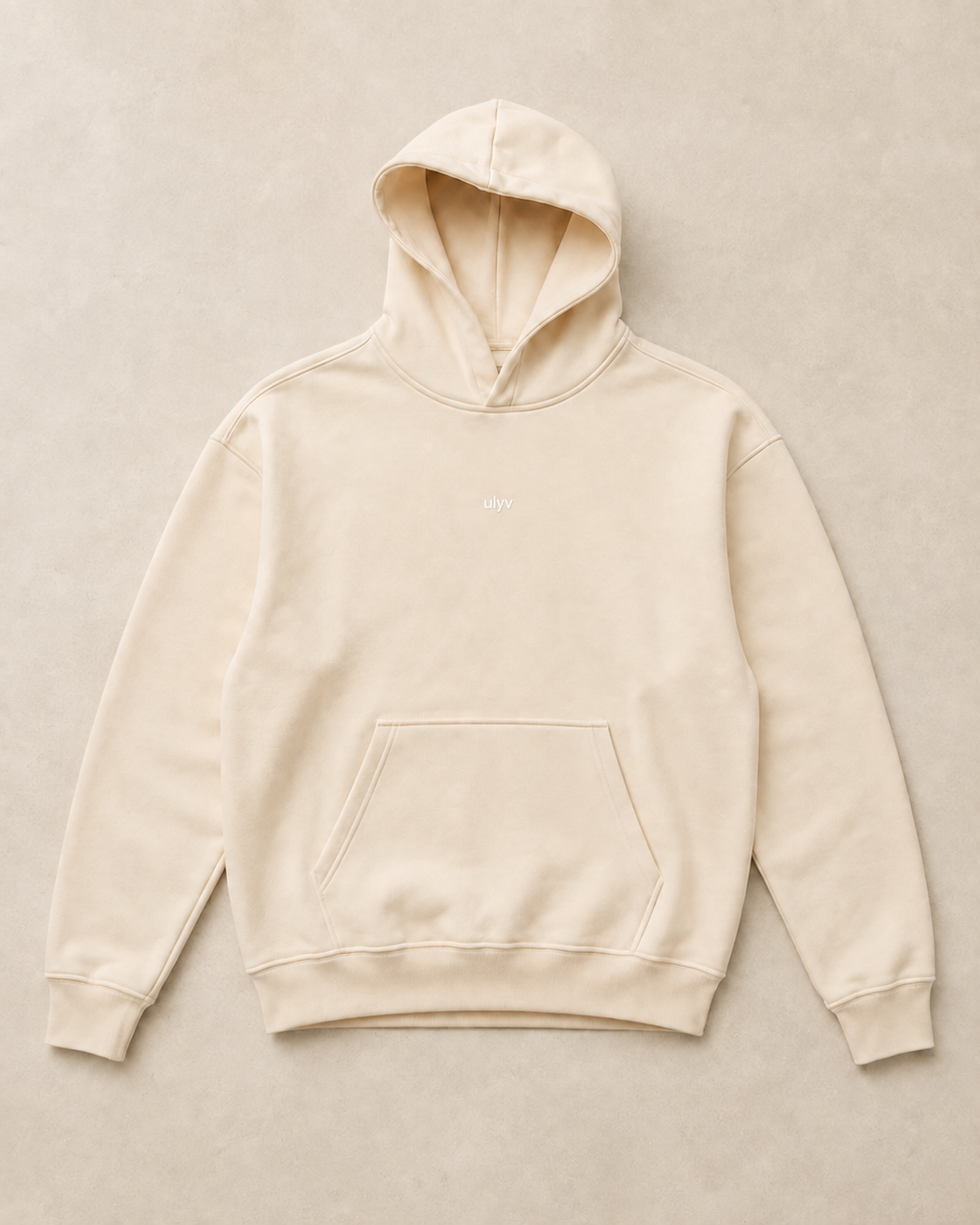 ULYV Cream Essential Hoodie product-only studio view
