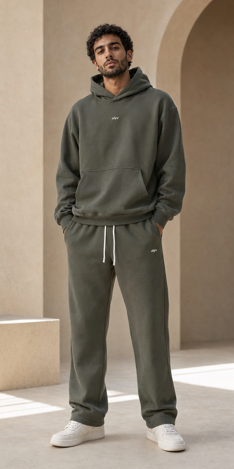Male adult model wearing the ULYV olive Essential matching set