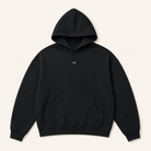ULYV black Essential Hoodie studio view