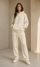 Female adult model wearing the ULYV cream Essential matching set