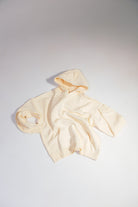 ULYV cream essential hoodie flat lay