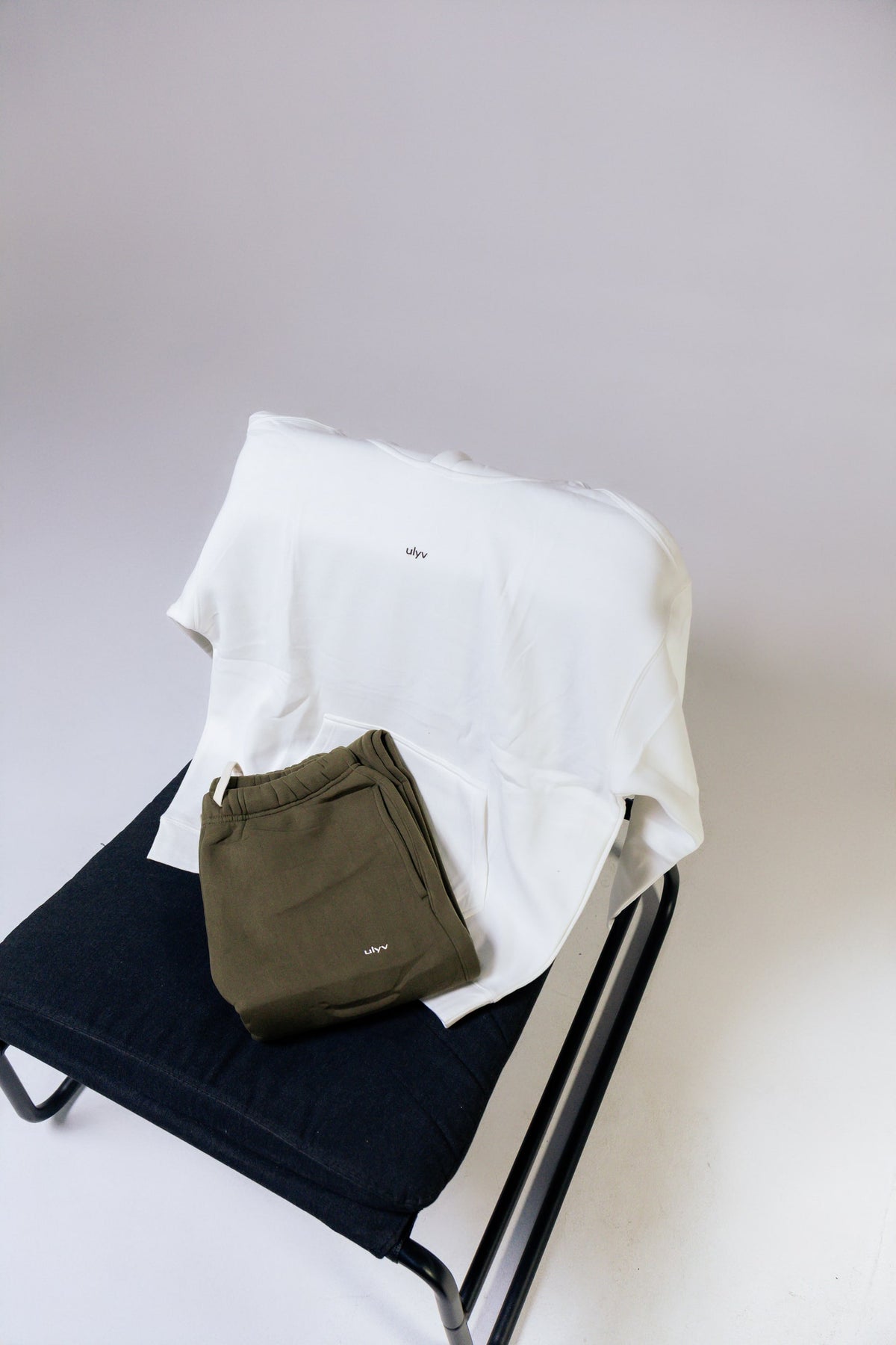 ULYV white Essential Hoodie with olive sweatpants