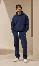 Male adult model wearing the ULYV navy Essential matching set