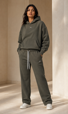 Female adult model wearing the ULYV olive Essential matching set