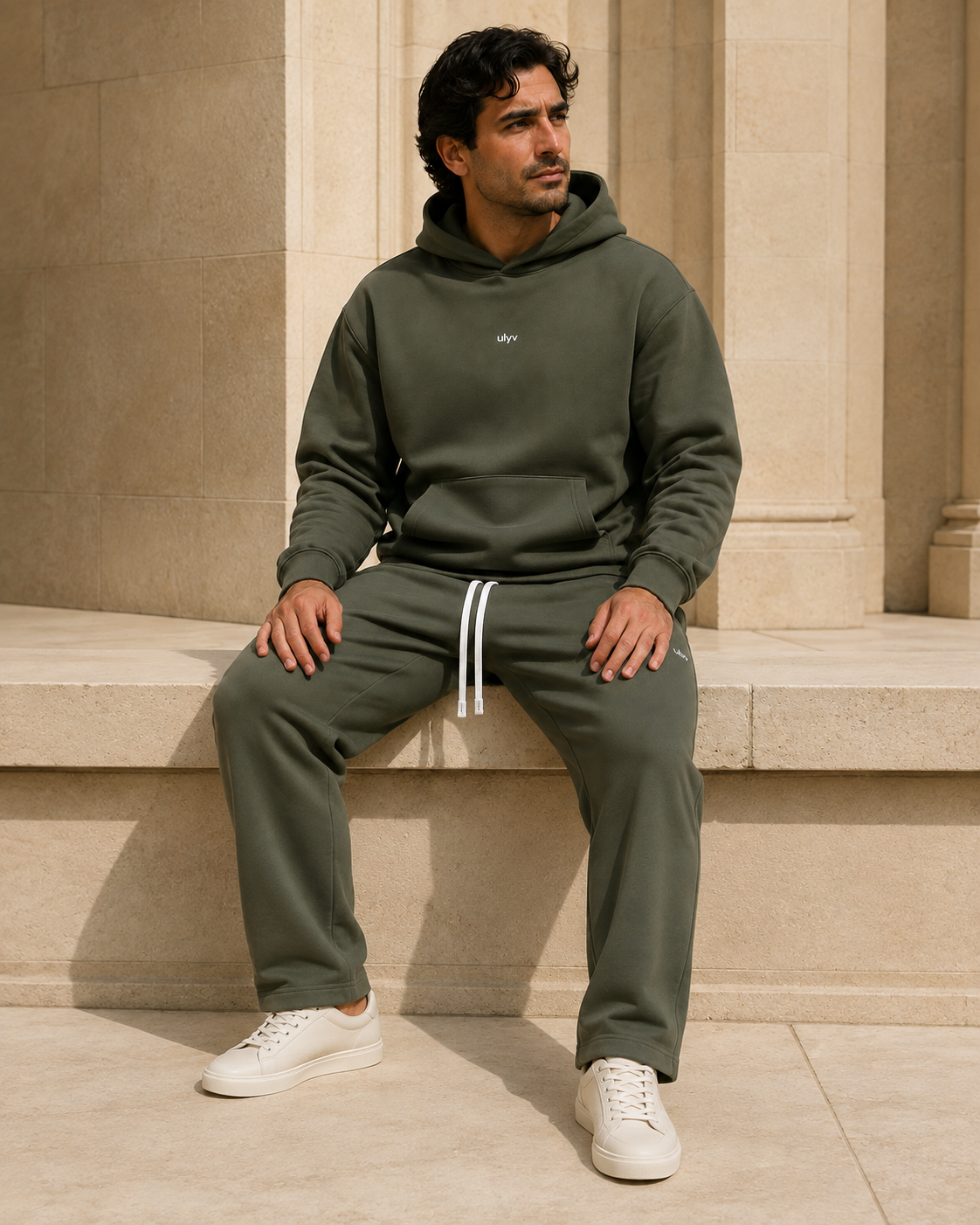Adult model in the ULYV Olive matching hoodie and sweatpants, full length view