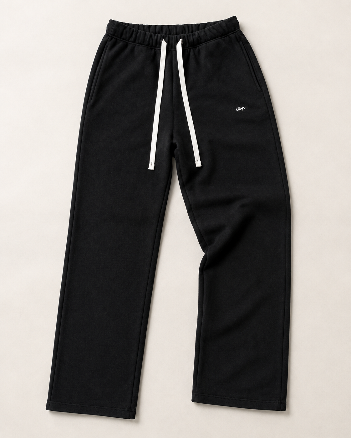 Black ULYV Essential Sweatpants alone, full product studio view
