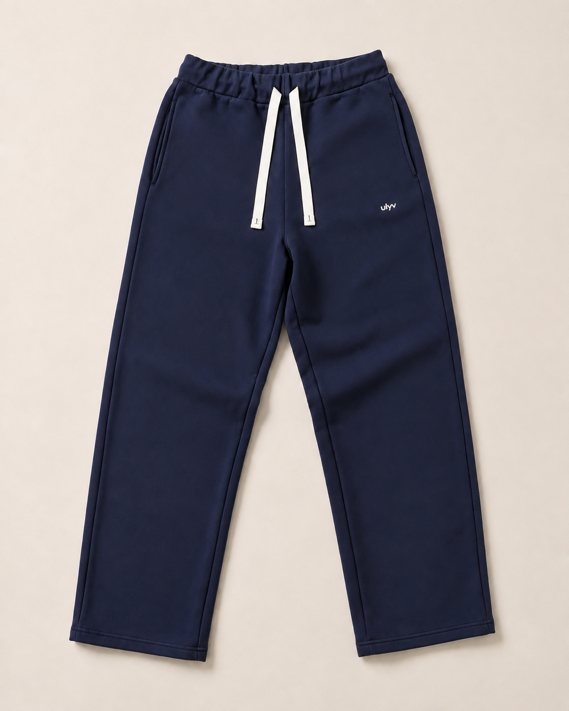 Navy ULYV Essential Sweatpants alone, full product studio view
