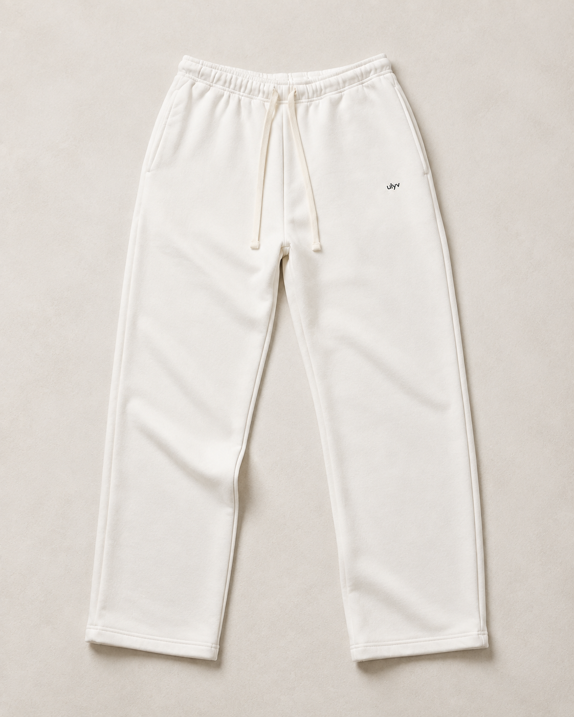 White ULYV Essential Sweatpants alone, full product studio view