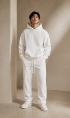 Male adult model wearing the ULYV white Essential matching set