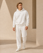 White ULYV matching hoodie and sweatpants on an adult male model, full length view
